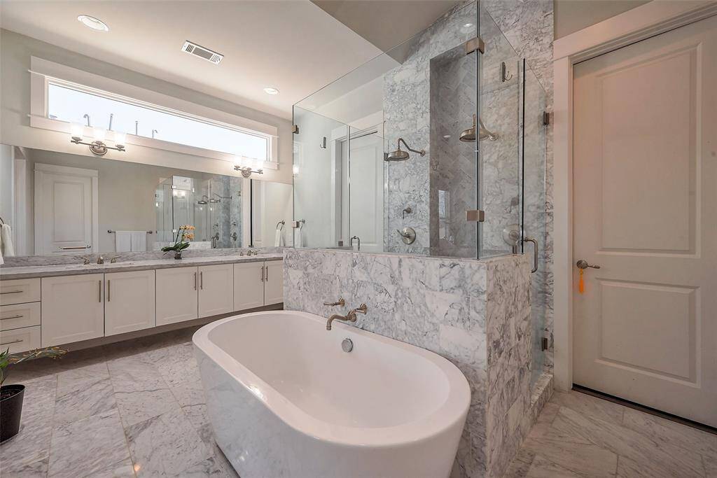 Stand alone tub, double head walk in shower