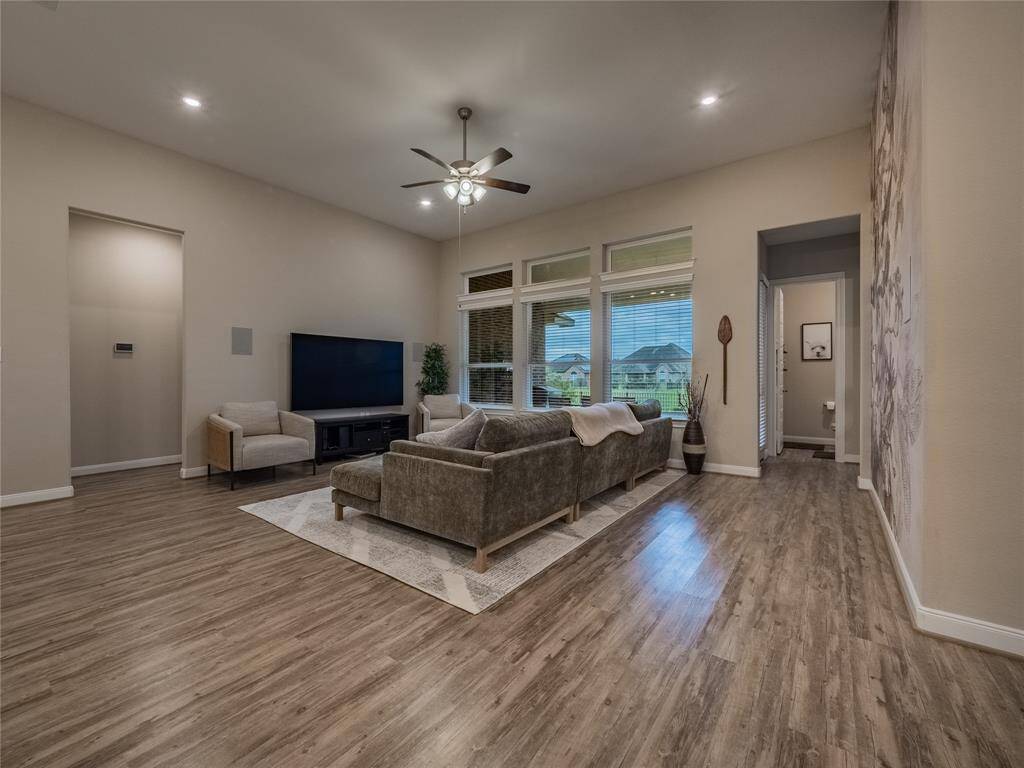 the entrance on the left is to the primary bed and bath from the family room on the right is the back door, guest bed and bath and half bath