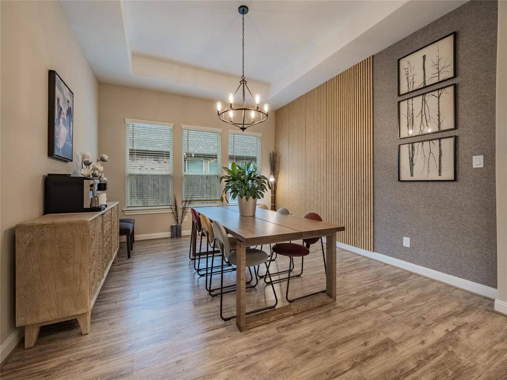 this is the true dining area, with upgrades to the wall and lighting , high trey ceilings