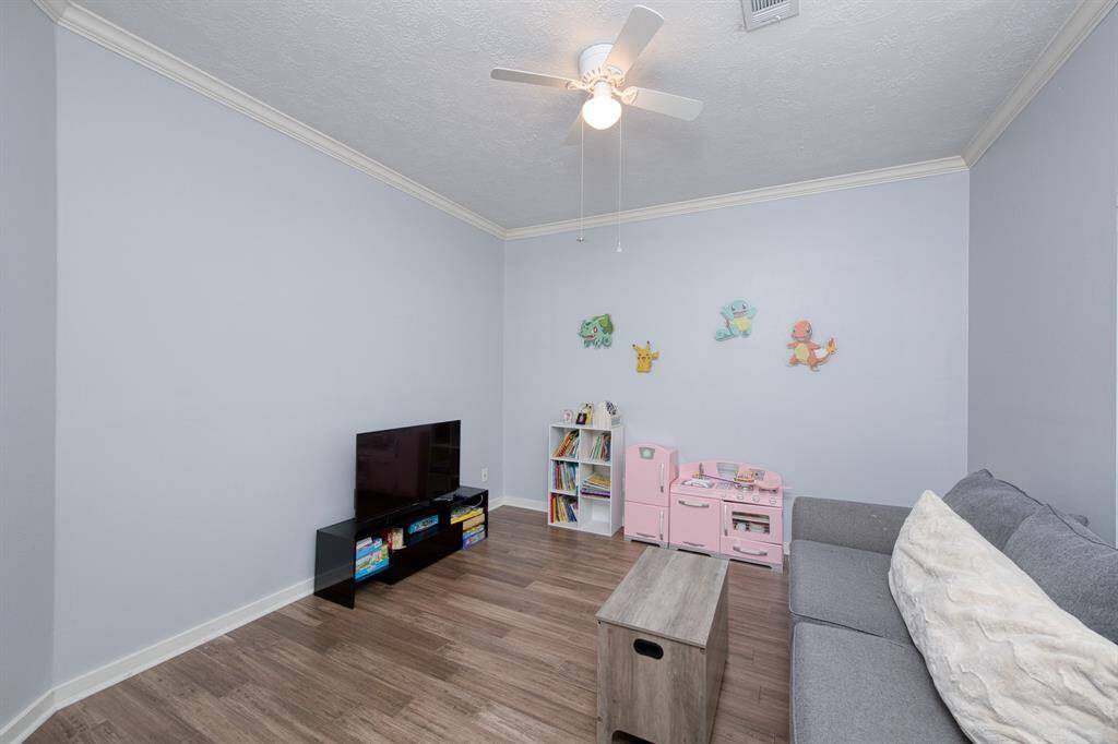 Office off of the entry is being used as a flex space/play room