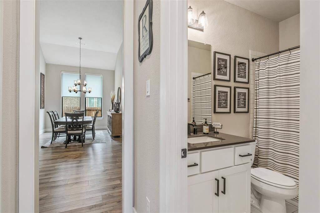 Bathroom is centrally located off the dining room.