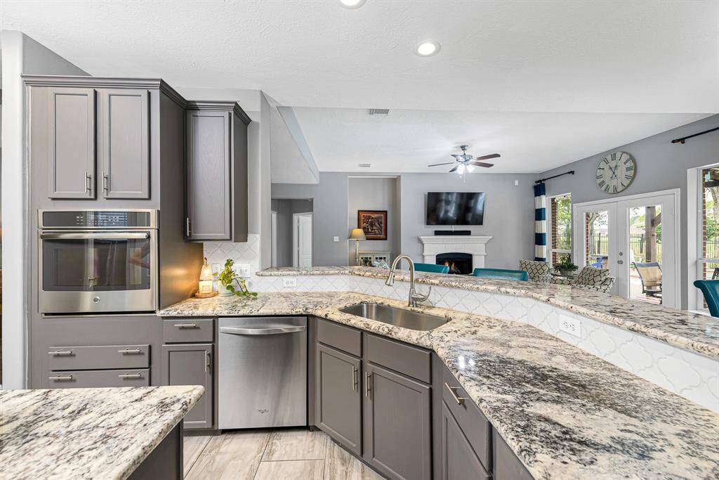 Plenty of counter and cabinet space. Beautiful granite countertops and extra long breakfast bar overlook the family room