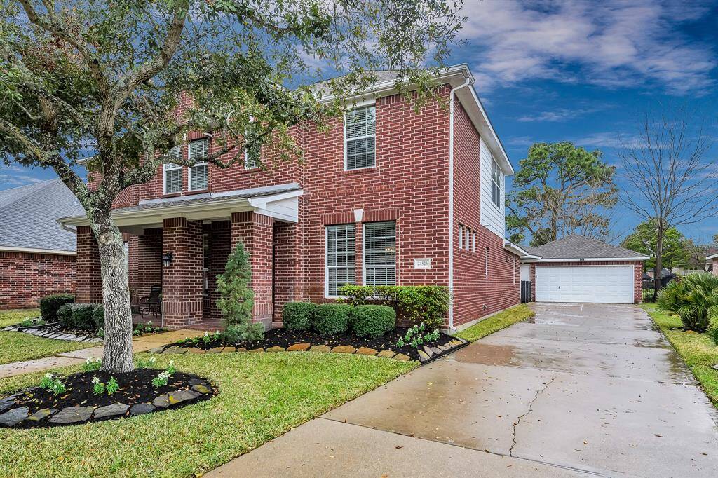 Double wide driveway and 2 car attached/detached garage