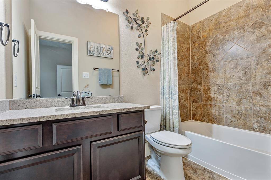 This is full bathroom connected to the secondary bedroom downstairs