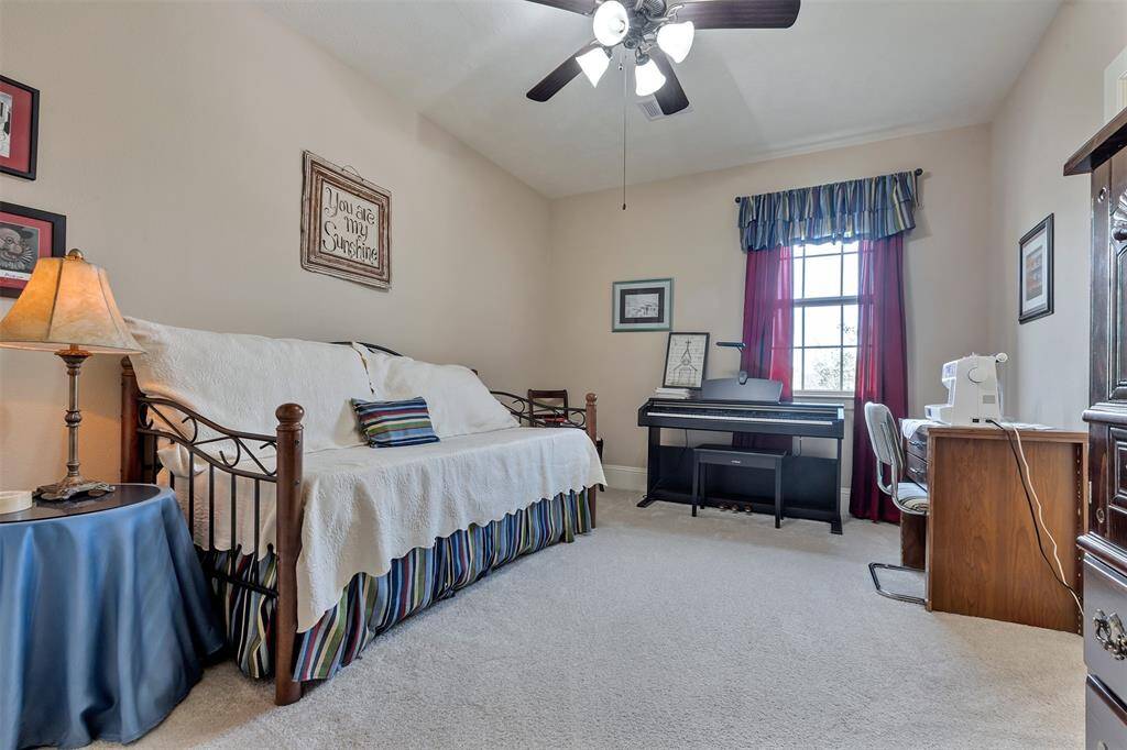 This bedroom is also located upstairs. This bedroom shares a bathroom