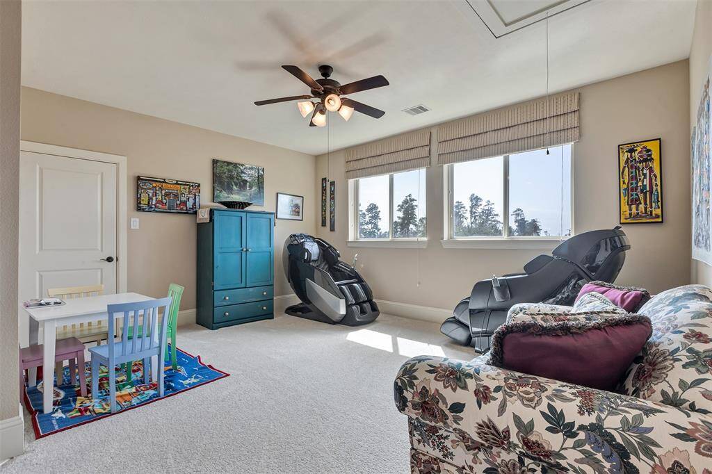 This is another game room/ living area/ flex space located upstairs. Ideal for large families.