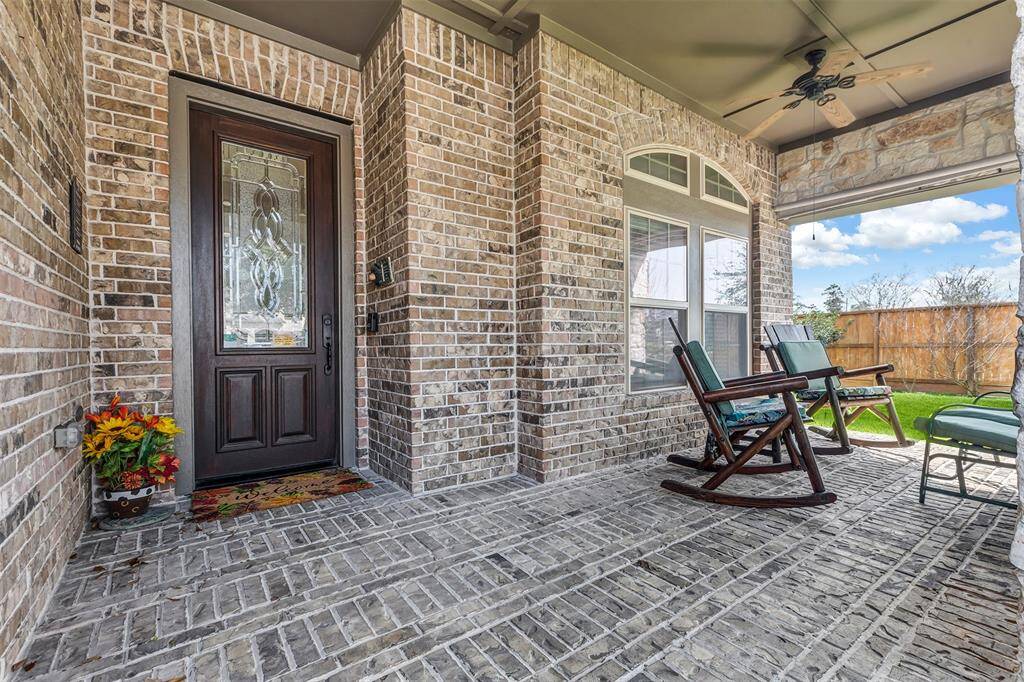Check out the charming covered front porch and leaded glass front door.
