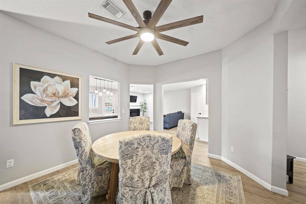 The formal dining area sits just next to the living room with cased openings leading to the kitchen & family room.