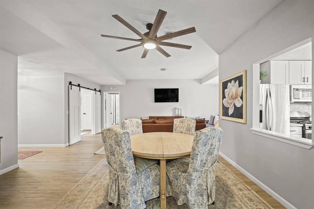 Included is a ceiling fan with light fixture & gleaming luxury vinyl plank hardwood floors.