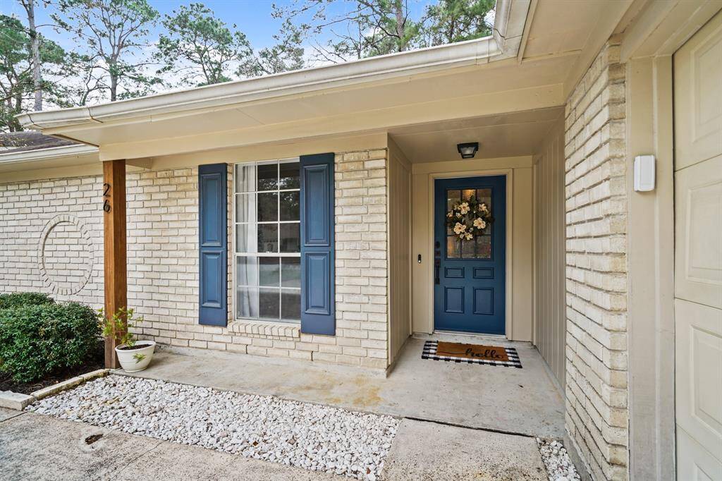 Perfect for greeting family & guests, the charming covered front porch supported by a decorative wood-stained column includes a ceiling mounted light fixture, keyless front door entry & a video door bell.