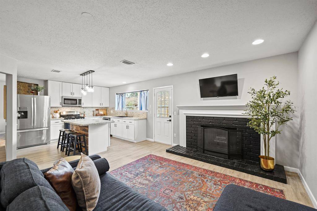 A view of the kitchen from the back of the family room.