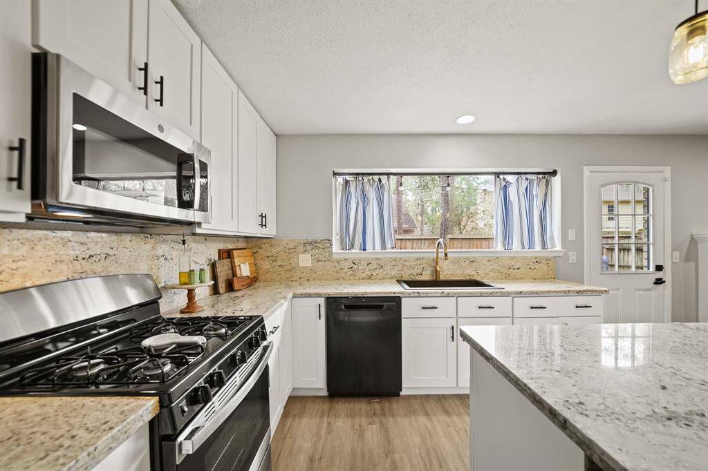 Imagine preparing your favorite meals and recipes in this thoughtfully planned kitchen surrounded by plenty of counter, cabinet & drawer space with soft-close cabinets & drawers. An over-sized walk-in pantry is accessible nearby.