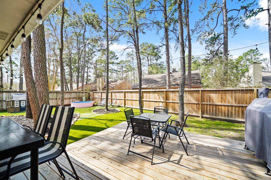 Enjoy the look of year round green grass with the artificial turfed section of the yard just off deck.