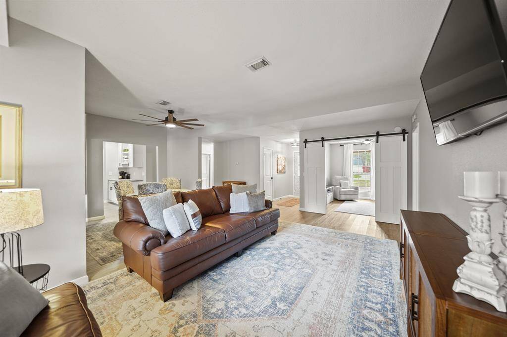 The formal living room flows seamlessly to the formal dining.