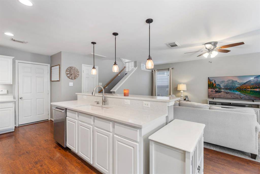 Just off the kitchen, a door leads to the 2-car attached garage, providing easy access and added convenience.