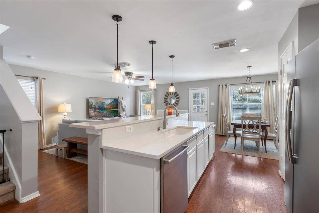 This home is filled with natural light, and off the living area, you'll find easy access to the fenced backyard, perfect for outdoor enjoyment and privacy.