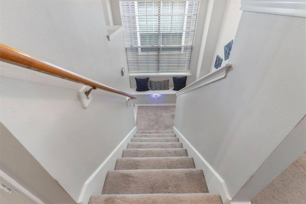 As you head upstairs, enjoy the comfort of plush carpeting that adds warmth and coziness to the space.