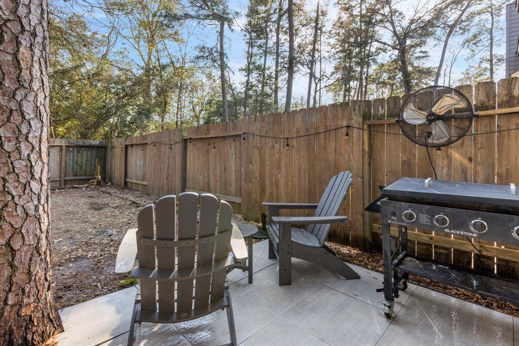 Look out and enjoy the peaceful views of lush trees and nature, creating a tranquil and serene atmosphere right in your own backyard.
