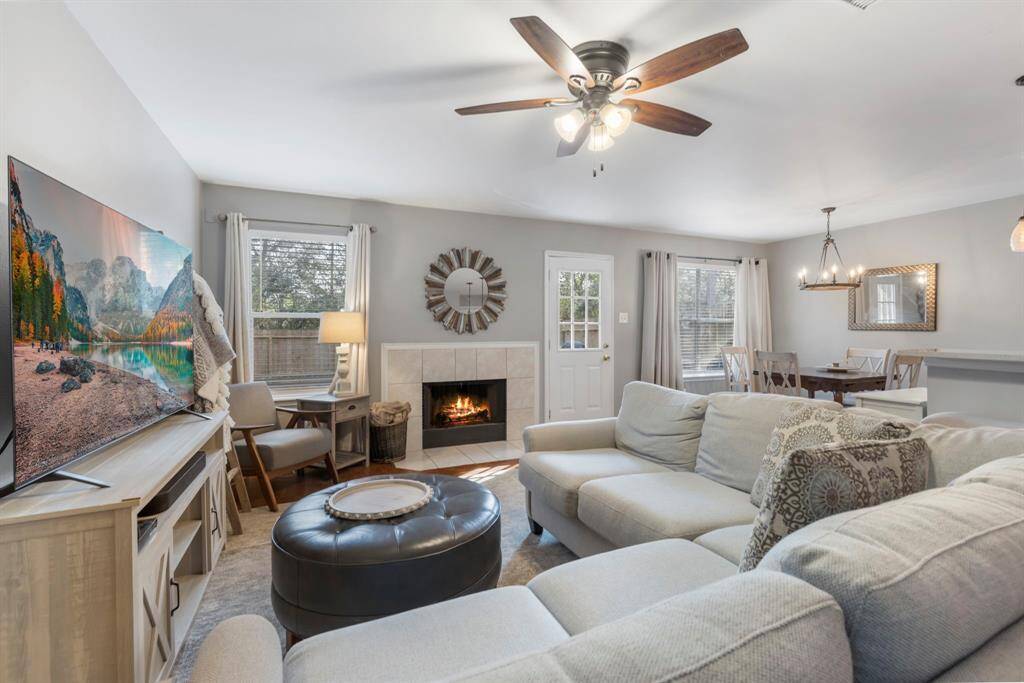 Downstairs features a spacious, open-concept living area filled with natural light, creating a bright and airy ambiance perfect for relaxing or entertaining.