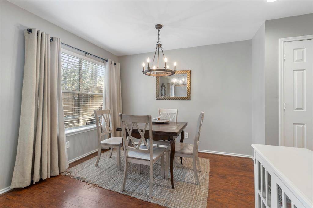 A charming breakfast nook sits adjacent to the kitchen, perfect for enjoying morning coffee or casual meals.