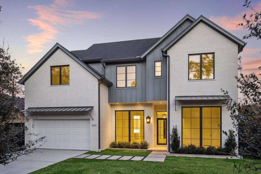 [Front Elevation]Built by Dorsey Homes in an inviting Transitional style, the residence at 2711 Eastgrove Lane presents 4,750 sf of living area wrapped within an inviting parged brick exterior.[