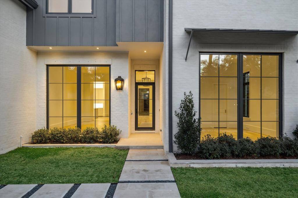 [Front Entrance]A deep portico entrance opens into the foyer. Note aluminum clad front door.
