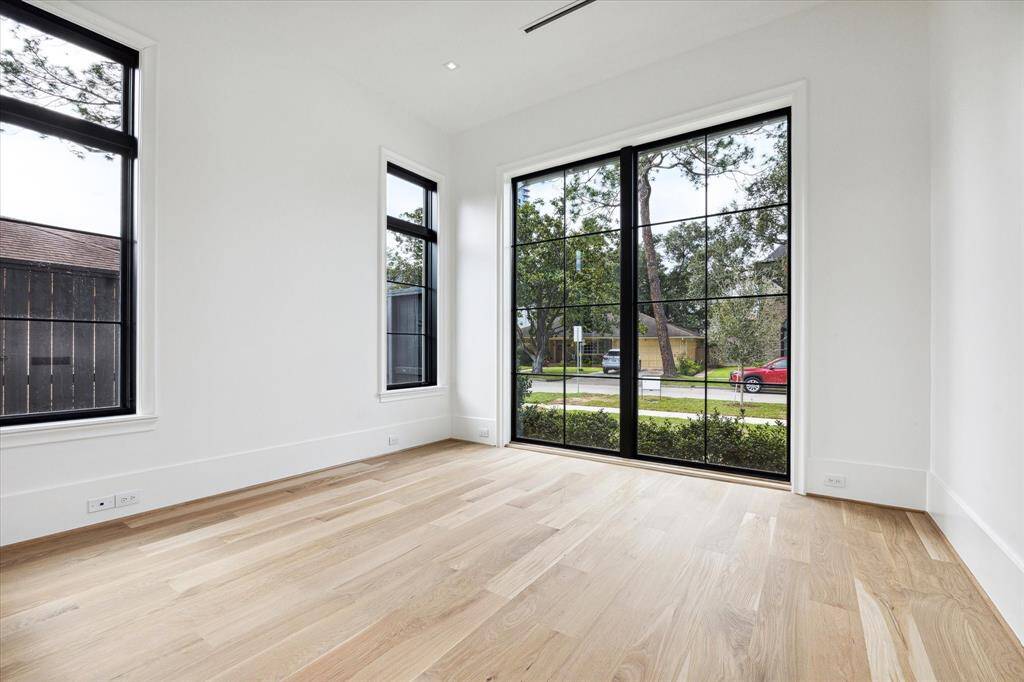 [Study / Bedroom]Located next to the foyer, the study includes a full bath and would serve as a bedroom if desired.