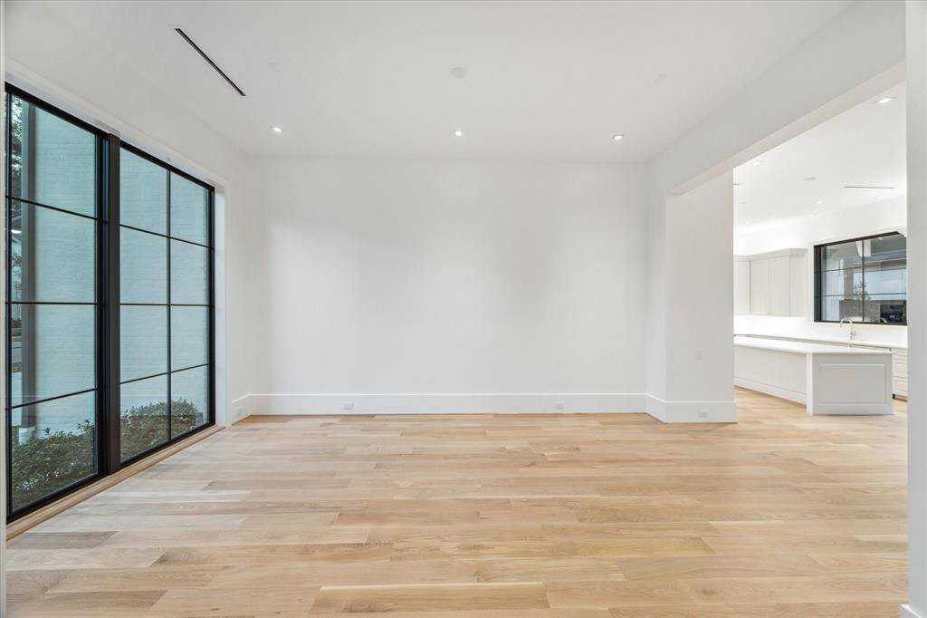 [Dining Room]An alternate view of the dining room reveals the open transition to the gathering kitchen.