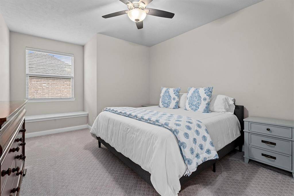 Between 2 upstairs bedroom is this Hollywood bath. Each bedroom enjoys a private sink area and shares the toilet and shower space.