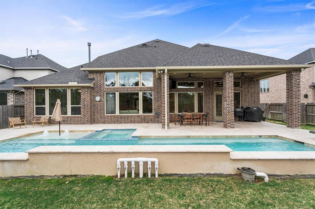 Large covered patio with dual fans for those hot Texas summers.