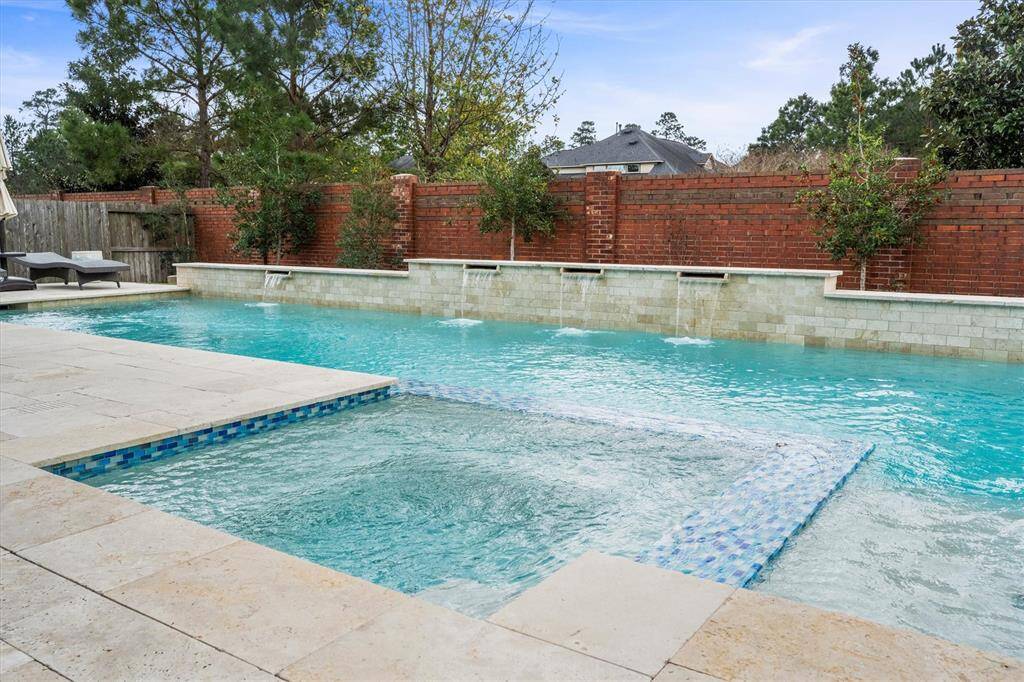 Grass space behind pool is will keep the pets or kids happy as well.