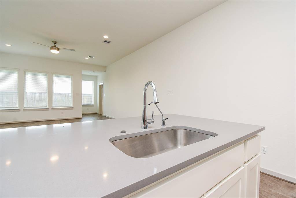 Among upgrades, are new stainless steel appliances (don't you love this big farmhouse style sink?), refrigerator, microwave oven, washer/dryer, and tankless water heater, among others.