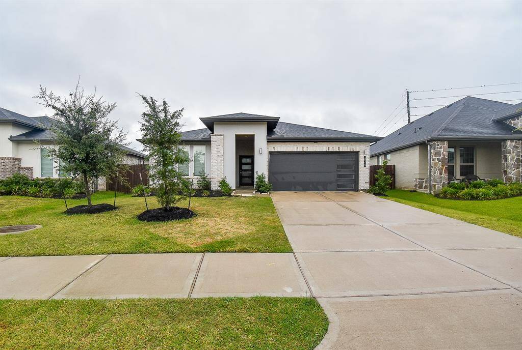 Just pull right into the dual-vehicle attached garage, via the welcoming driveway.