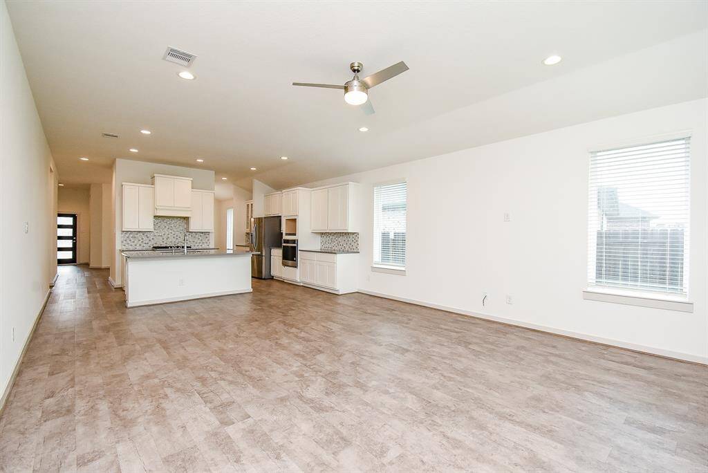 Isn't this wide open space incredible? The timeless beauty and practicality of the open floor plan design concept never fails to work! Can you begin to see your precious furnishings in this huge combined living/family, kitchen space, with a clear view right to the front door?