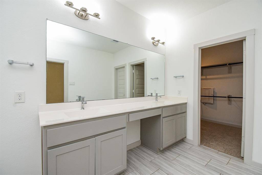 The primary walk-in closet sits just off the primary bath.