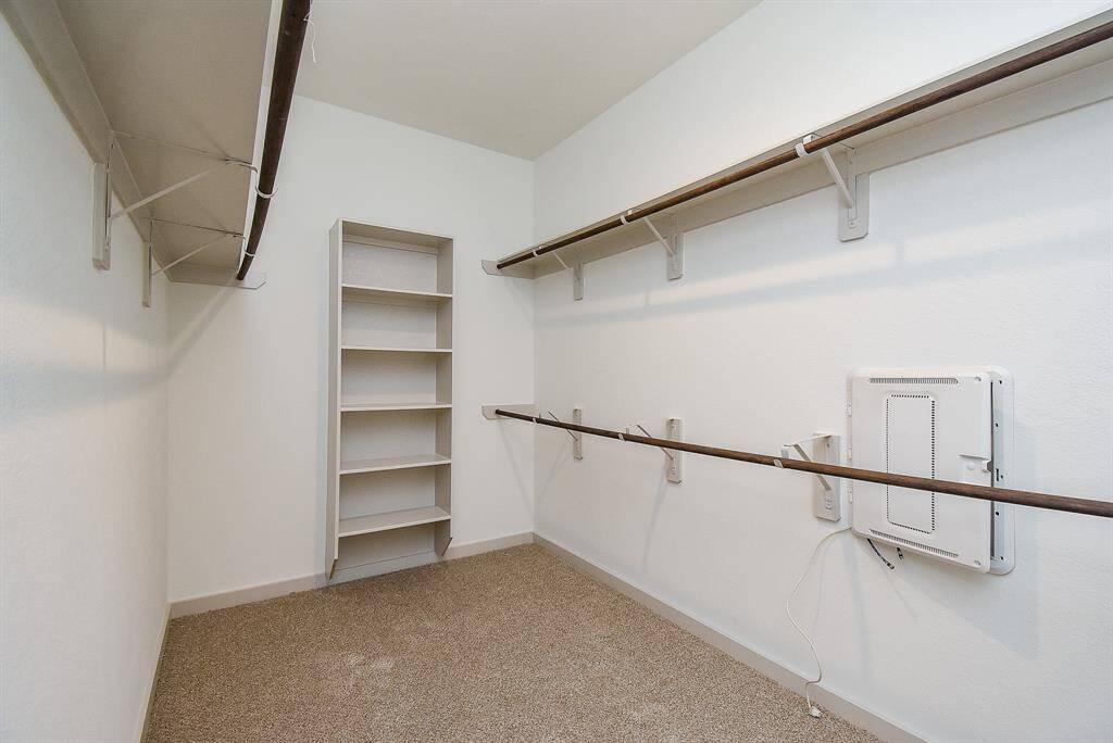 The carpeted primary walk-in closet is amazing, with room and storage options for just about everything you own!