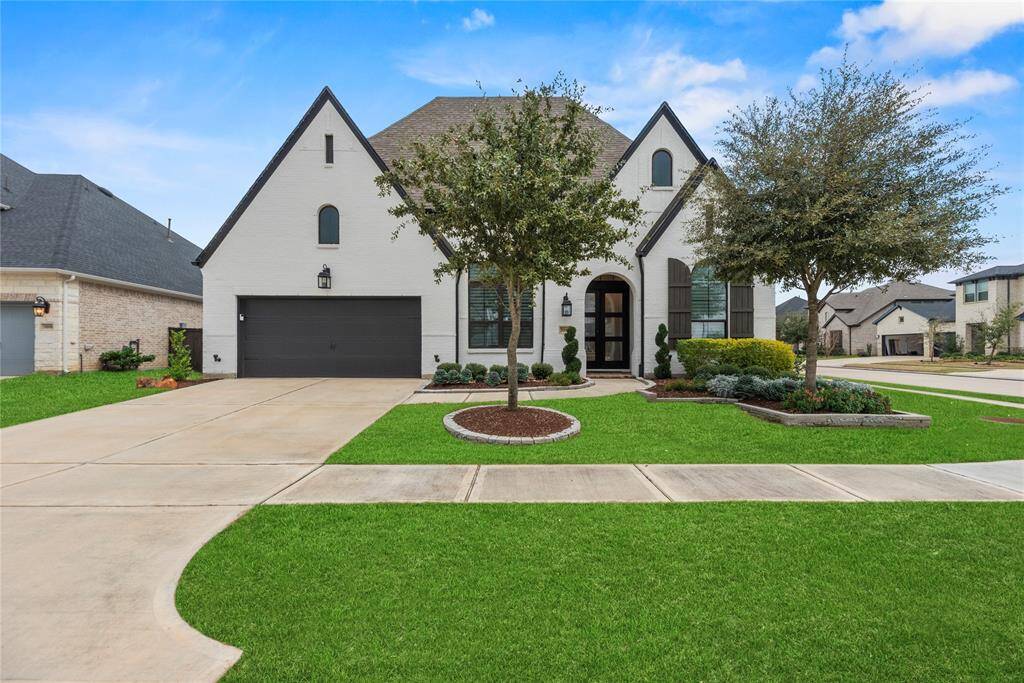 Welcome home to 3002 Bluestem Road nestled in the prestigious Cane Island community in Katy!