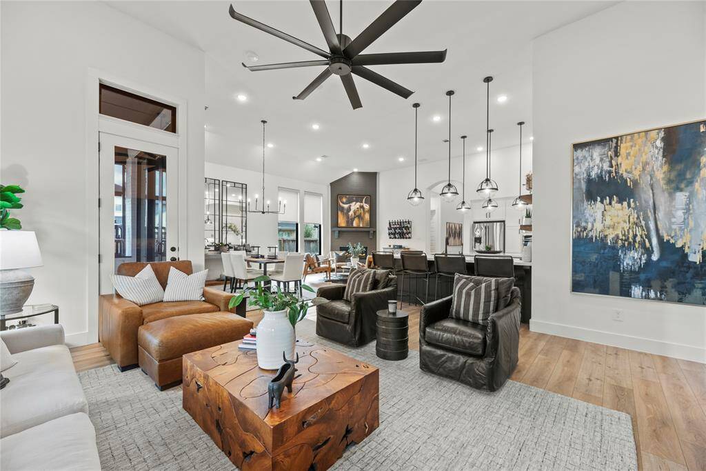 Overall, the open feel of the home encourages interaction and engagement, making it a welcoming and inviting place for family and friends to gather and enjoy each other's company.