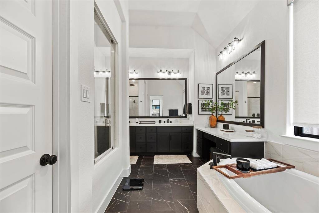 Dual vanities in your primary bath, offer personal space with tons of dedicated cabinet space.
