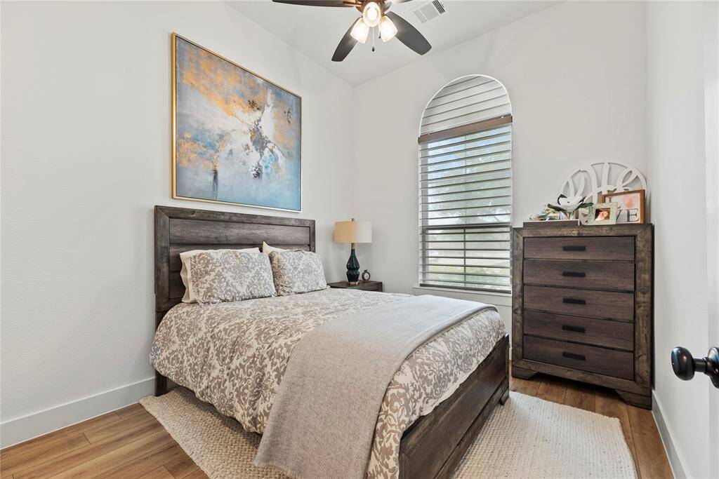 The thoughtfully designed layout of the second bedroom allows for natural light to flood the room, creating a warm and welcoming atmosphere.