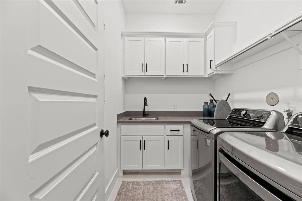 This well-appointed space includes ample storage and efficient organization, making laundry day a breeze while keeping your home tidy and functional.