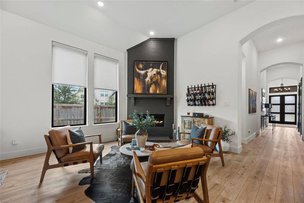 The inviting fireplace becomes a focal point that anchors the room and invites people to gather and linger, making it a cherished feature of the living area.