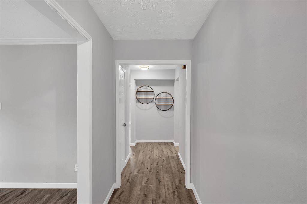 Just to the right at the end of the entry hallway is the utility room with the washer & dryer