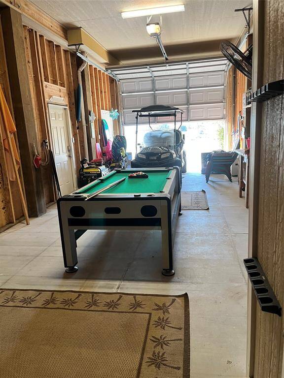 Large over-sized garage w/ half bath.