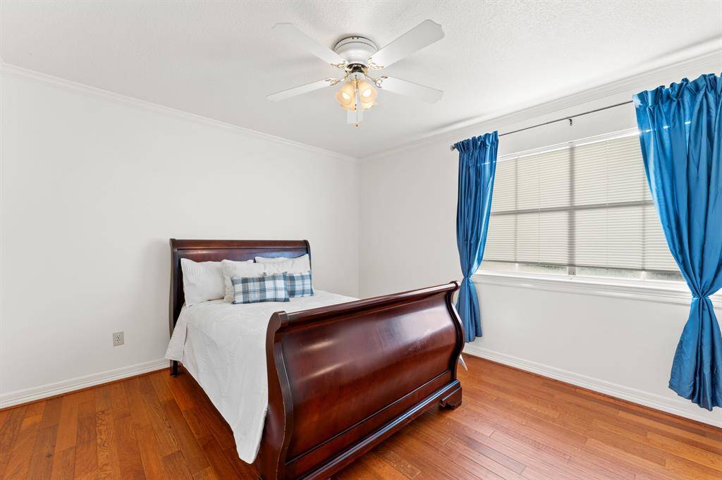 2nd floor bedroom #3 with large window for natural lighting, oakwood flooring and a large walk in closet