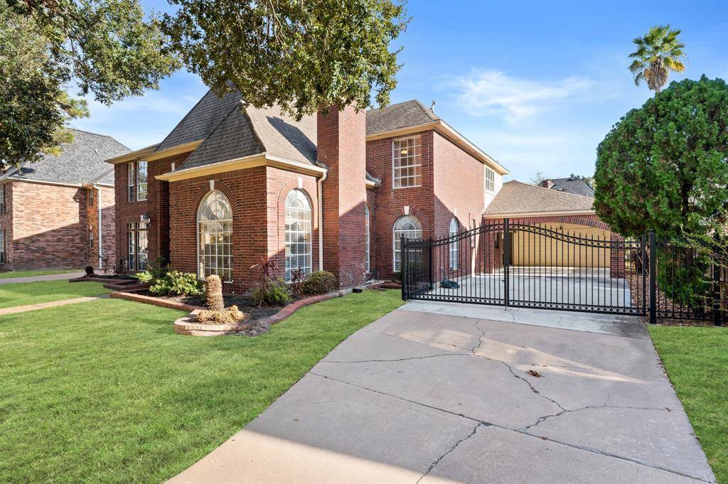 Plenty of driveway space manned gate with 2 car garage