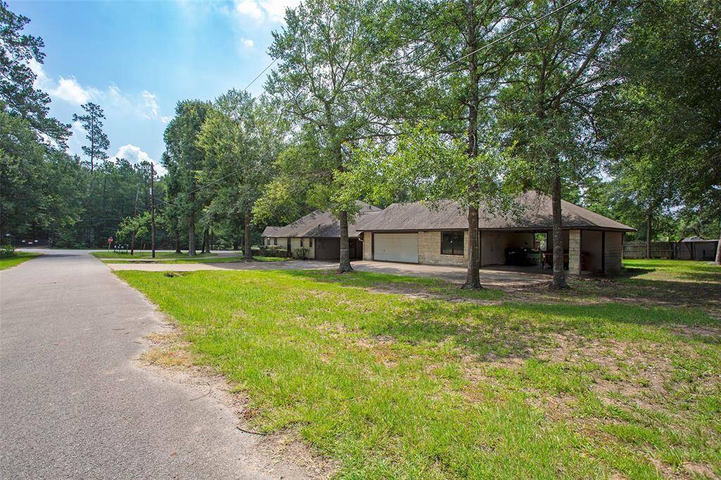 a rare find. covered parking, attached garage and workshop w additional patio space beside workshop. Well house under the roof line, protected with additional storage inside well house. Aerobic septic w sprinkler system also.