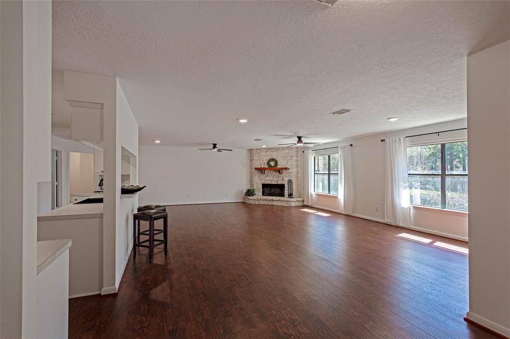 view of living room show a wall of windows and open plan