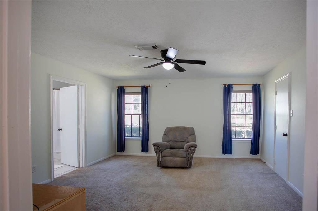 primary bedroom with en suite bath and walk in closets