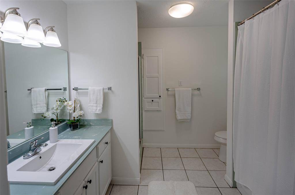 primary bath has tub/shower combo and walk in shower